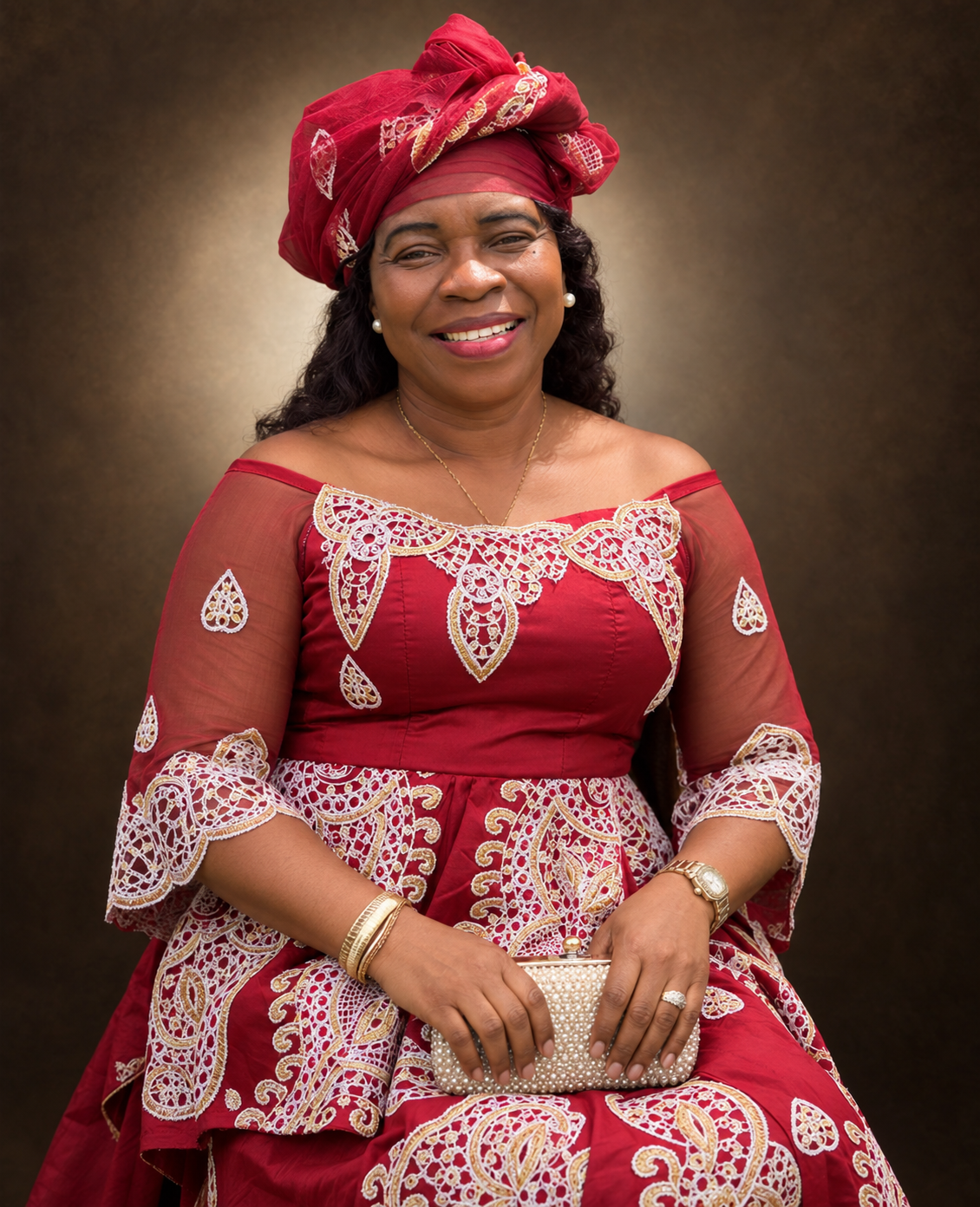 Mrs. Helen Mason-Payway in an elegant burgundy and gold outfit